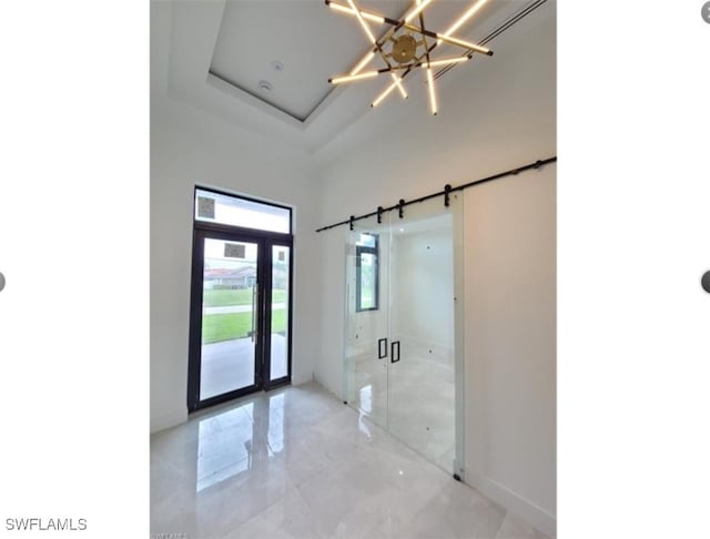 4612 SW 22nd Pl, Cape Coral, FL 33914 - entrance foyer featuring light marble finish flooring, a chandelier, and a high ceiling