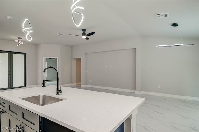 3606 51st St W, Lehigh Acres, FL 33971 - kitchen featuring marble look tiles, a kitchen island with sink, pendant lighting, light stone countertops, and ceiling fan