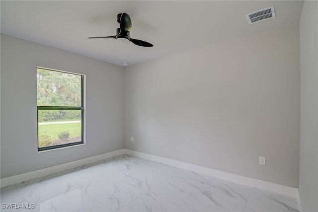 3606 51st St W, Lehigh Acres, FL 33971 - empty room with light marble finish flooring and ceiling fan