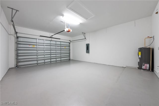 3111 11th St W, Lehigh Acres, FL 33971 - garage with electric water heater, a garage door opener, and electric panel