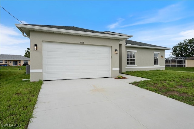 3111 11th St W, Lehigh Acres, FL 33971 - view of front of home featuring stucco siding, driveway, a front lawn, and an attached garage