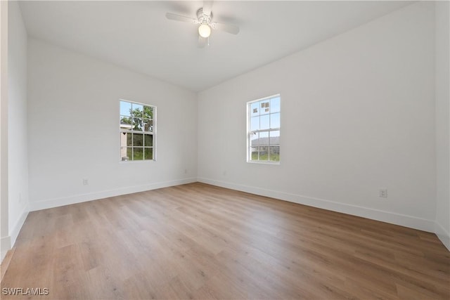 3111 11th St W, Lehigh Acres, FL 33971 - unfurnished room featuring light wood-style floors and a ceiling fan