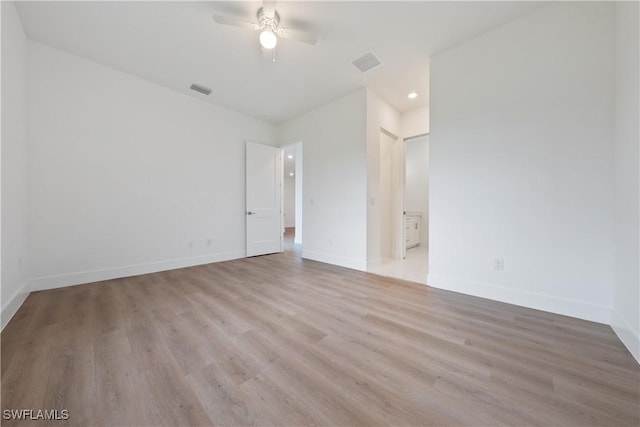3111 11th St W, Lehigh Acres, FL 33971 - spare room featuring wood finished floors, ceiling fan, and recessed lighting