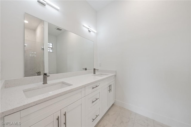 3111 11th St W, Lehigh Acres, FL 33971 - full bath with double vanity, marble look tiles, and tiled shower