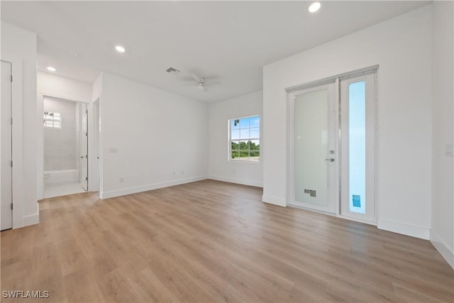 3111 11th St W, Lehigh Acres, FL 33971 - empty room featuring a ceiling fan, light wood-style floors, and recessed lighting