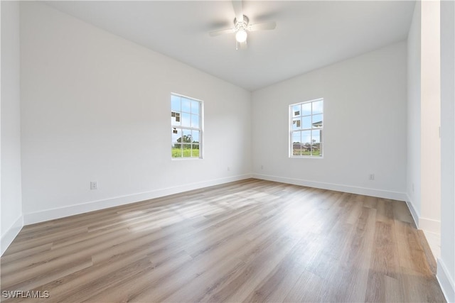 3109 11th St W, Lehigh Acres, FL 33971 - spare room with a ceiling fan and light wood-style flooring