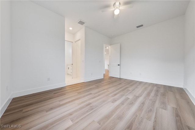 3109 11th St W, Lehigh Acres, FL 33971 - unfurnished bedroom featuring light wood-style floors, ensuite bath, ceiling fan, and recessed lighting