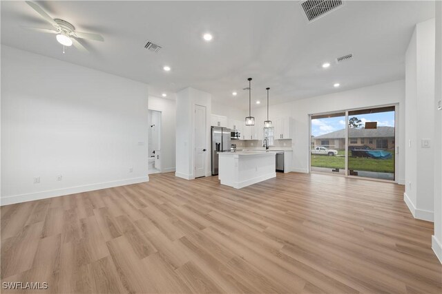 3109 11th St W, Lehigh Acres, FL 33971 - unfurnished living room featuring recessed lighting, light wood-style flooring, and ceiling fan