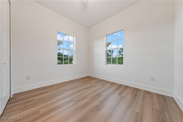 3109 11th St W, Lehigh Acres, FL 33971 - spare room featuring plenty of natural light and light wood-style floors