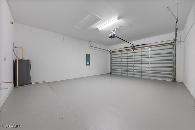3109 11th St W, Lehigh Acres, FL 33971 - garage featuring water heater, electric panel, and a garage door opener
