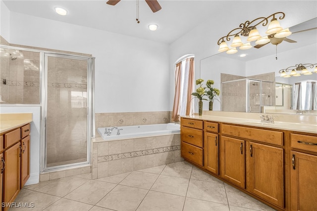14813 Canton Ct, Naples, FL 34114 - full bath featuring a ceiling fan, vanity, a garden tub, a shower stall, and tile patterned floors