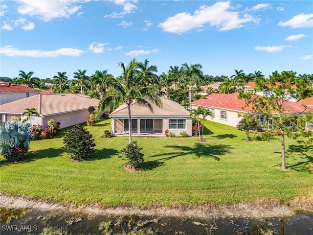 14813 Canton Ct, Naples, FL 34114 - back of house featuring a lawn