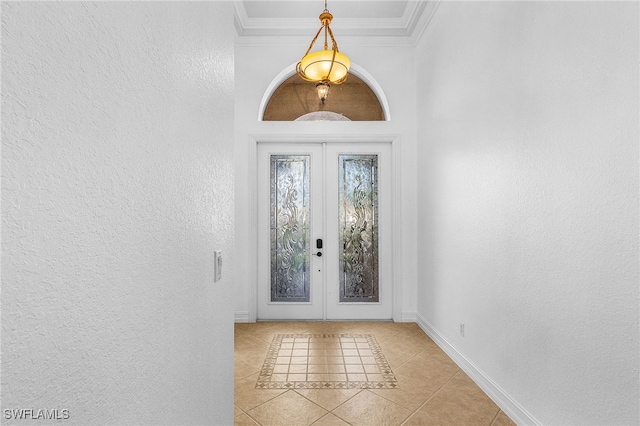 14813 Canton Ct, Naples, FL 34114 - entryway with french doors, light tile patterned floors, ornamental molding, and a textured wall