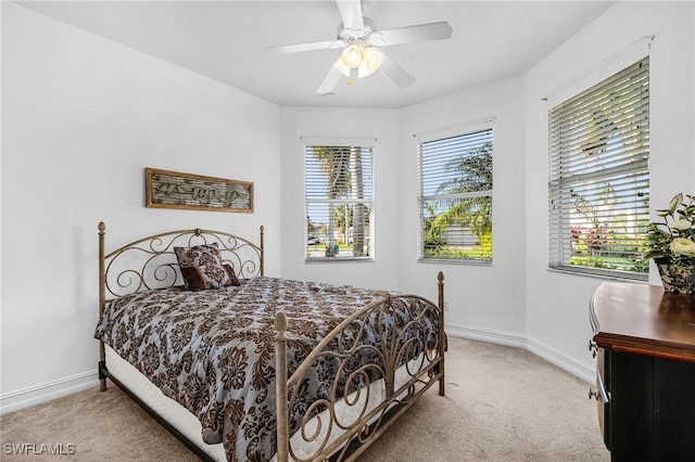 14813 Canton Ct, Naples, FL 34114 - bedroom with light carpet and a ceiling fan