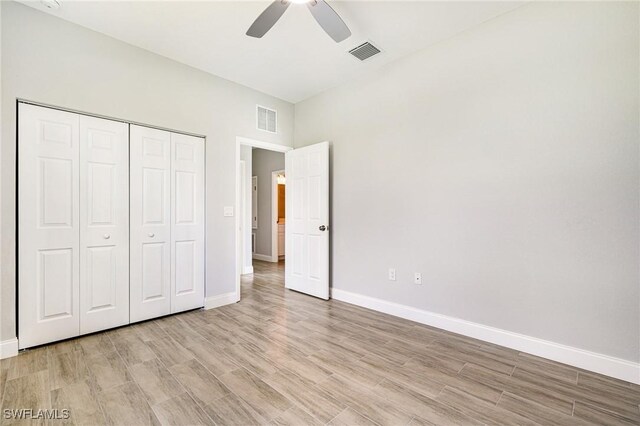 1909 Moore Ave, Lehigh Acres, FL 33972 - unfurnished bedroom with light wood-type flooring, a closet, and ceiling fan