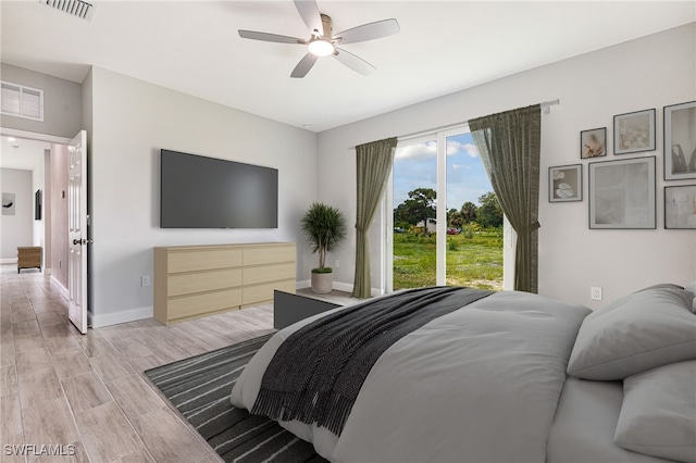 1909 Moore Ave, Lehigh Acres, FL 33972 - bedroom with light wood-type flooring and ceiling fan
