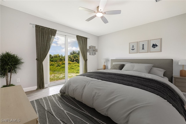 1909 Moore Ave, Lehigh Acres, FL 33972 - bedroom featuring access to exterior, wood finished floors, and ceiling fan