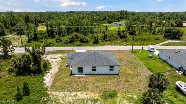 1909 Moore Ave, Lehigh Acres, FL 33972 - aerial view of property and surrounding area with a forest