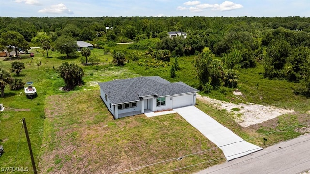 1909 Moore Ave, Lehigh Acres, FL 33972 - view from above of property with a forest