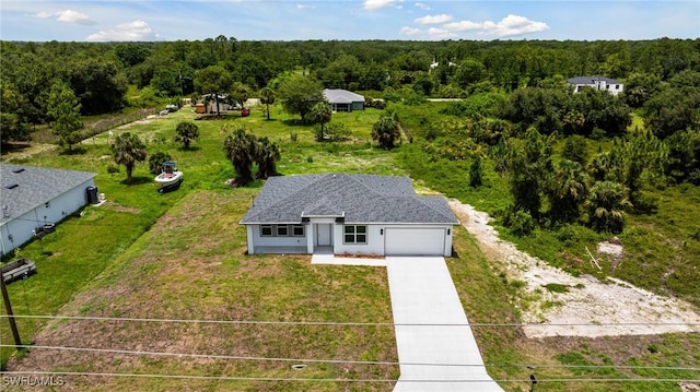 1909 Moore Ave, Lehigh Acres, FL 33972 - aerial view of property and surrounding area featuring a forest
