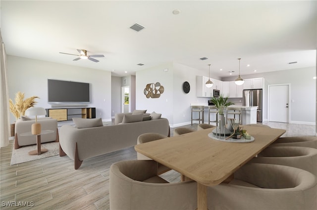 1909 Moore Ave, Lehigh Acres, FL 33972 - dining room featuring light wood-style floors, recessed lighting, and ceiling fan