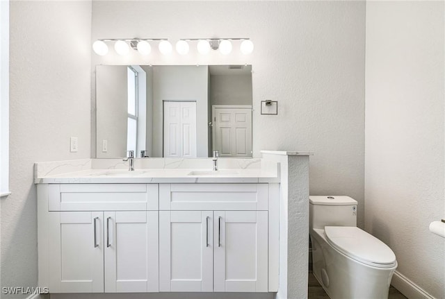 1909 Moore Ave, Lehigh Acres, FL 33972 - full bathroom with double vanity and a textured wall