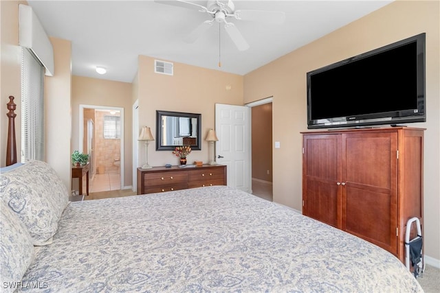76 4th St Unit 2-102, Bonita Springs, FL 34134 - bedroom with ceiling fan and ensuite bath