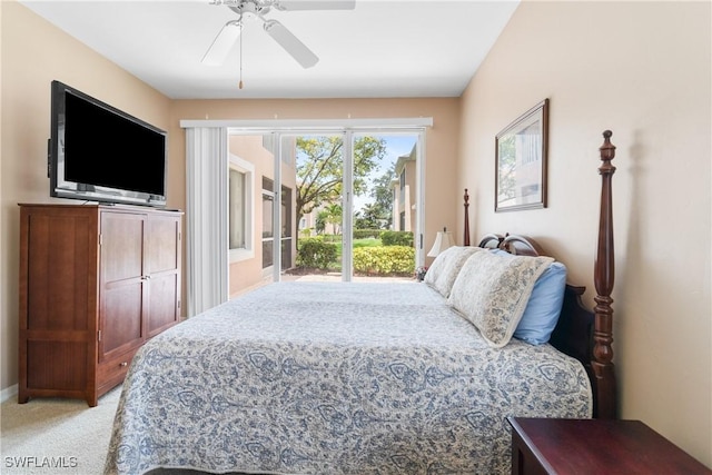 76 4th St Unit 2-102, Bonita Springs, FL 34134 - bedroom featuring access to exterior, light carpet, and a ceiling fan