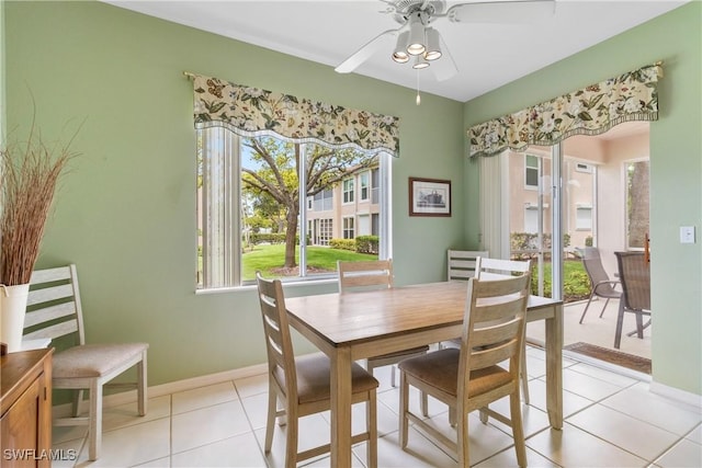 76 4th St Unit 2-102, Bonita Springs, FL 34134 - dining room with a ceiling fan and light tile patterned flooring