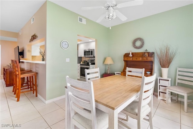 76 4th St Unit 2-102, Bonita Springs, FL 34134 - dining space featuring light tile patterned floors and a ceiling fan