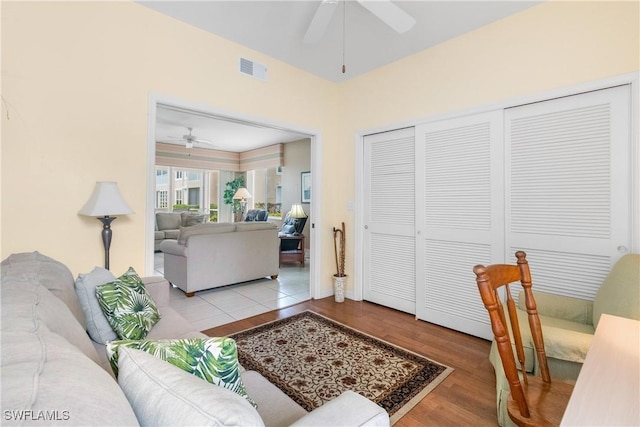 76 4th St Unit 2-102, Bonita Springs, FL 34134 - living area with a ceiling fan and wood finished floors