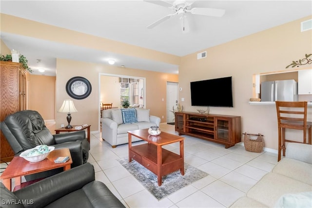 76 4th St Unit 2-102, Bonita Springs, FL 34134 - living area featuring a ceiling fan and light tile patterned floors