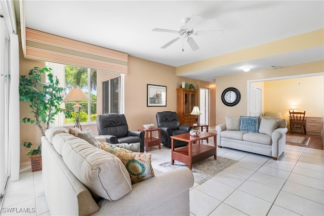 76 4th St Unit 2-102, Bonita Springs, FL 34134 - living room featuring light tile patterned floors and ceiling fan