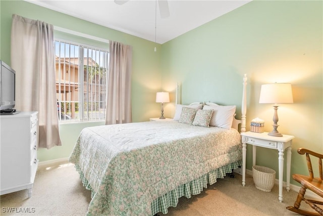 76 4th St Unit 2-102, Bonita Springs, FL 34134 - bedroom with carpet floors and a ceiling fan