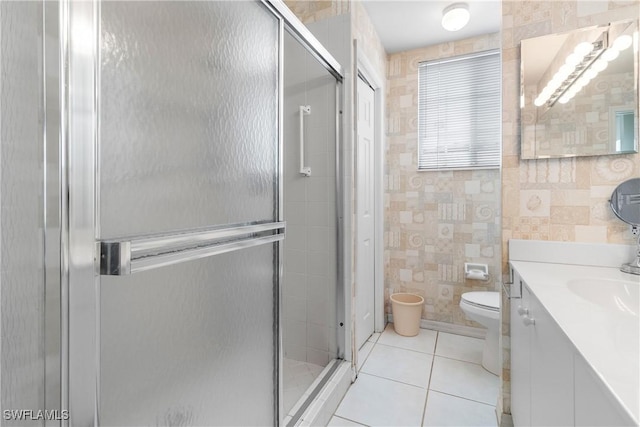 76 4th St Unit 2-102, Bonita Springs, FL 34134 - full bath with tile walls, vanity, tile patterned flooring, and a stall shower