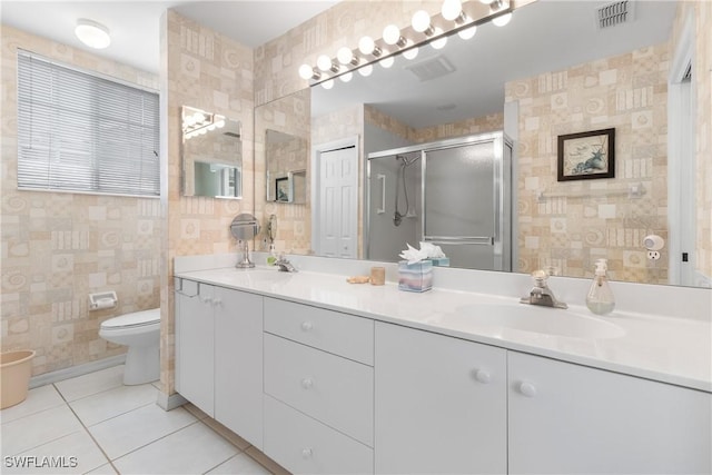 76 4th St Unit 2-102, Bonita Springs, FL 34134 - bathroom with double vanity, tile patterned floors, and a shower stall
