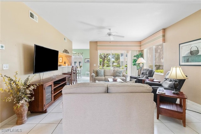 76 4th St Unit 2-102, Bonita Springs, FL 34134 - living room featuring light tile patterned floors and a ceiling fan