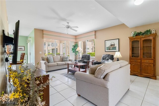76 4th St Unit 2-102, Bonita Springs, FL 34134 - living room with light tile patterned floors and a ceiling fan