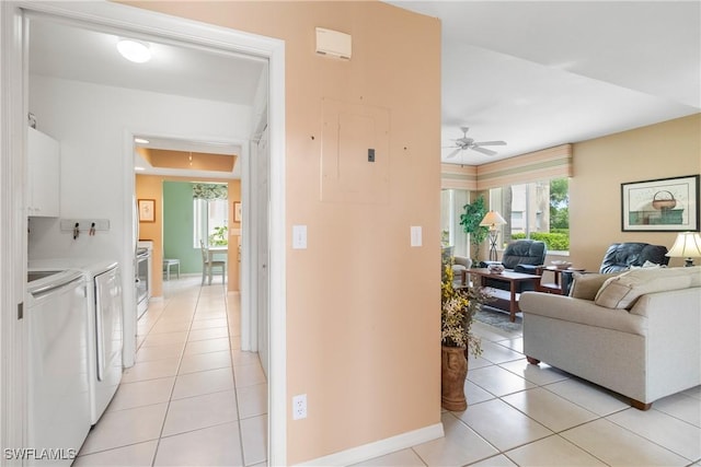 76 4th St Unit 2-102, Bonita Springs, FL 34134 - hall with washer and clothes dryer, electric panel, and light tile patterned floors