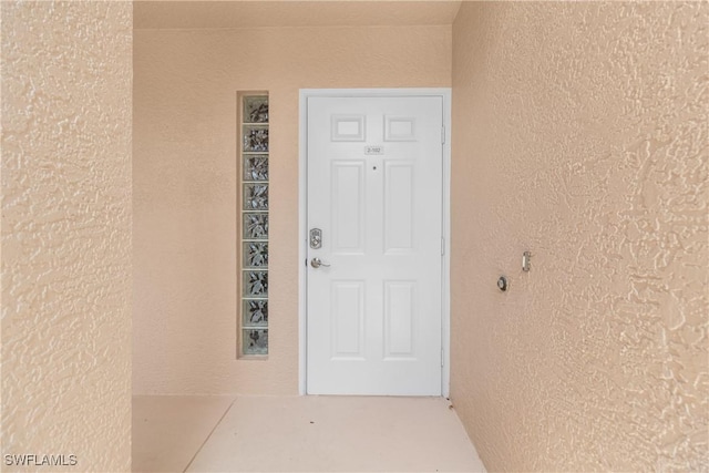 76 4th St Unit 2-102, Bonita Springs, FL 34134 - entrance to property featuring stucco siding