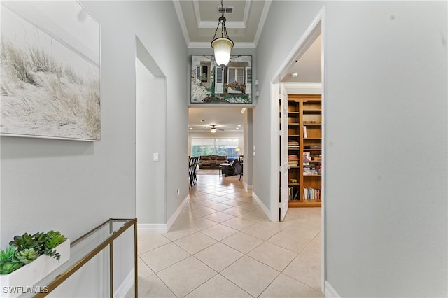 6899 Del Mar Ter, Naples, FL 34105 - hall with light tile patterned floors and crown molding