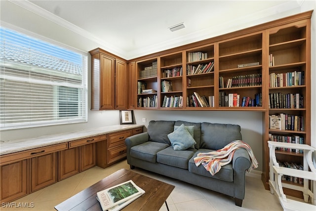 6899 Del Mar Ter, Naples, FL 34105 - sitting room featuring light tile patterned floors, built in desk, and crown molding