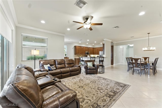 6899 Del Mar Ter, Naples, FL 34105 - living area featuring ceiling fan, light tile patterned floors, recessed lighting, a chandelier, and crown molding