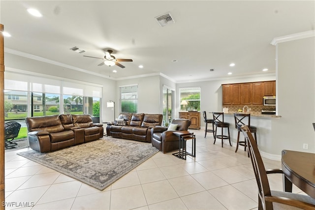 6899 Del Mar Ter, Naples, FL 34105 - living area featuring ceiling fan, light tile patterned floors, recessed lighting, and ornamental molding
