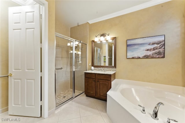 6899 Del Mar Ter, Naples, FL 34105 - bathroom with a stall shower, a garden tub, vanity, tile patterned flooring, and ornamental molding