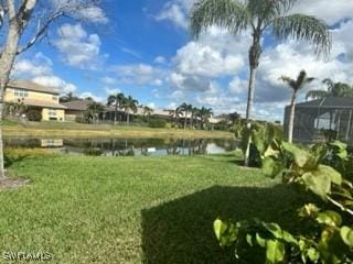 6899 Del Mar Ter, Naples, FL 34105 - view of grassy yard featuring a water view