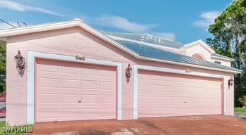 312 Lenz Ave S, Lehigh Acres, FL 33974 - garage featuring driveway