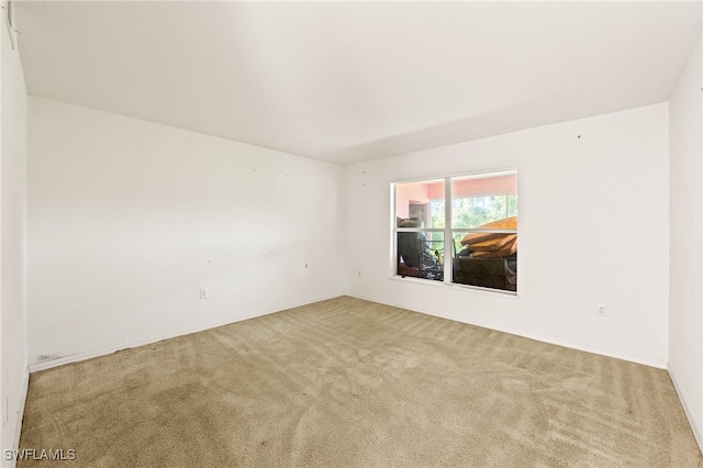 312 Lenz Ave S, Lehigh Acres, FL 33974 - carpeted spare room with baseboards