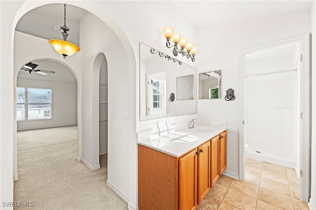 312 Lenz Ave S, Lehigh Acres, FL 33974 - bathroom with vanity, a shower stall, and a ceiling fan