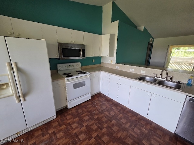 3022 34th St SW, Lehigh Acres, FL 33976 - kitchen with appliances with stainless steel finishes, high vaulted ceiling, white cabinetry, and light countertops
